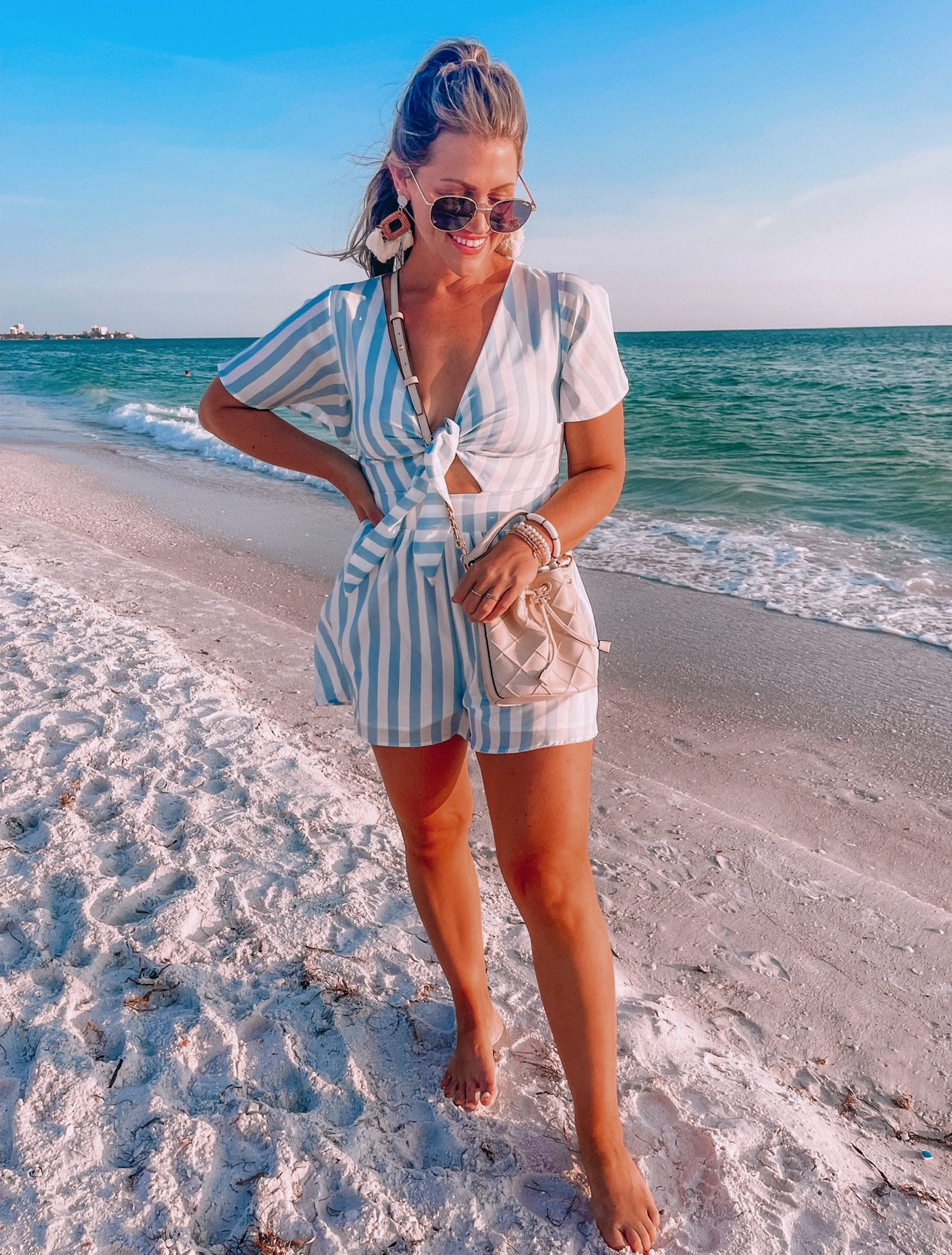 Some of my favorite date looks by the beach from last spring break and summer 🩵☀️ if you have upcoming trips, I highly recommend each of these outfits!! // sizing help: romper- small. If you’re busty go up one! I’m a 36B for reference. // size M swimsuit // size small aerie coverup (if in between in shorts go up one.. no stretch. But the top runs oversized!) // blue amazon maxi small // Amazon skort and white sweater small // both white dresses size small // blue dress with cut outs size M! //

Spring break outfit ideas
Resort wear
Florida
Mexico
Trips
Travel
Vacation
Summer 
Spring break
