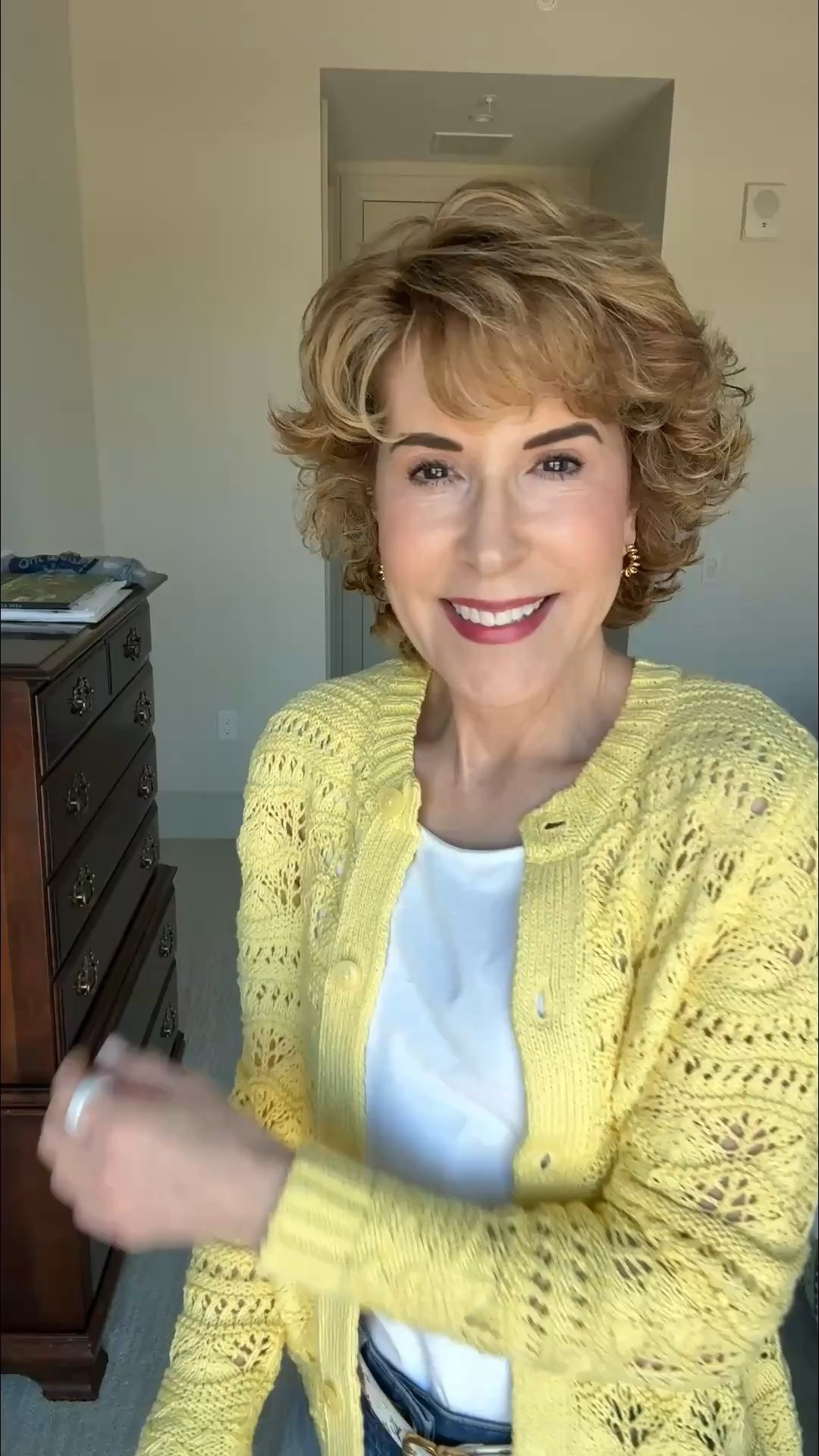 An easy, pulled-together look featuring an on-trend open stitch cardigan layered over a white tank and paired with comfy cuffed jeans. The cardigan adds just the right amount of texture and polish, while the jeans keep it casual and wearable for everyday.

#LTKOver40 #LTKootd #LTKSeasonal