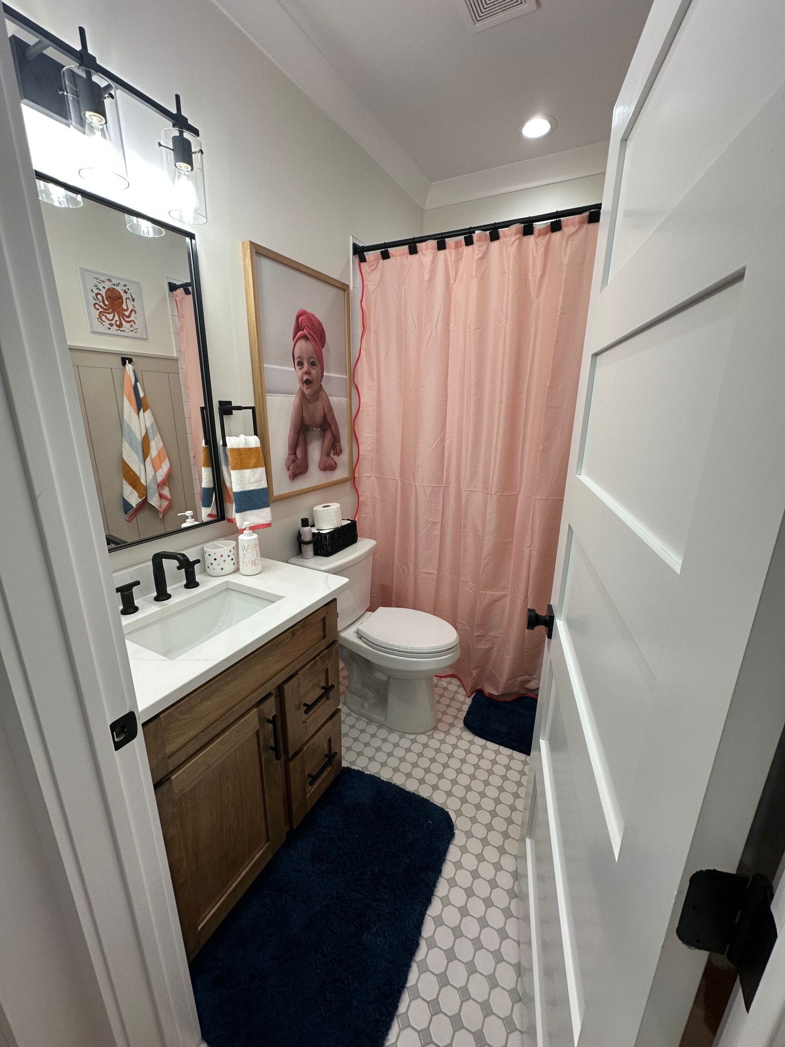 Recently redone our guest bathroom for our Josie girl & im obsessed 🦭🐙🐠

Little girl bathroom links. Kid bathroom links. Kid bathroom decor links. Home decor links. 

Custom wall art is Small Woods.  

#LTKHome #LTKBaby #LTKStyleTip