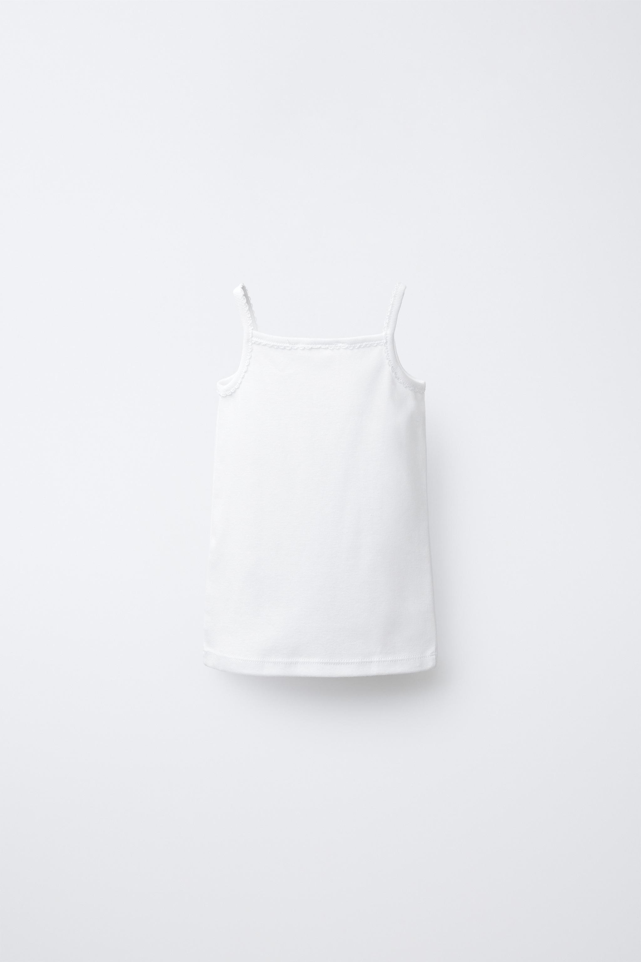 DescriptionContentsMeasurementsPack of three round neck tank tops.White8501/475/250 | Zara US