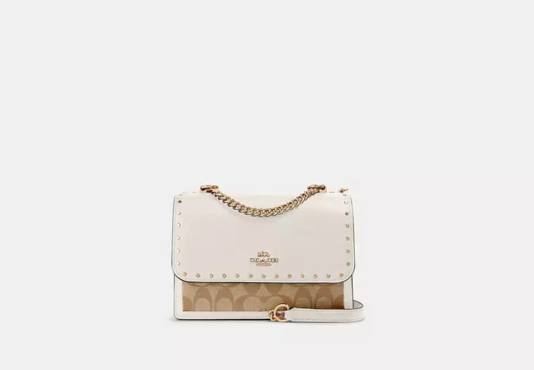 Klare Crossbody Bag In Signature Canvas With Rivets | Coach Outlet US