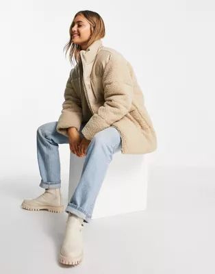 ASOS DESIGN leather look patched fleece puffer jacket in stone | ASOS (Global)