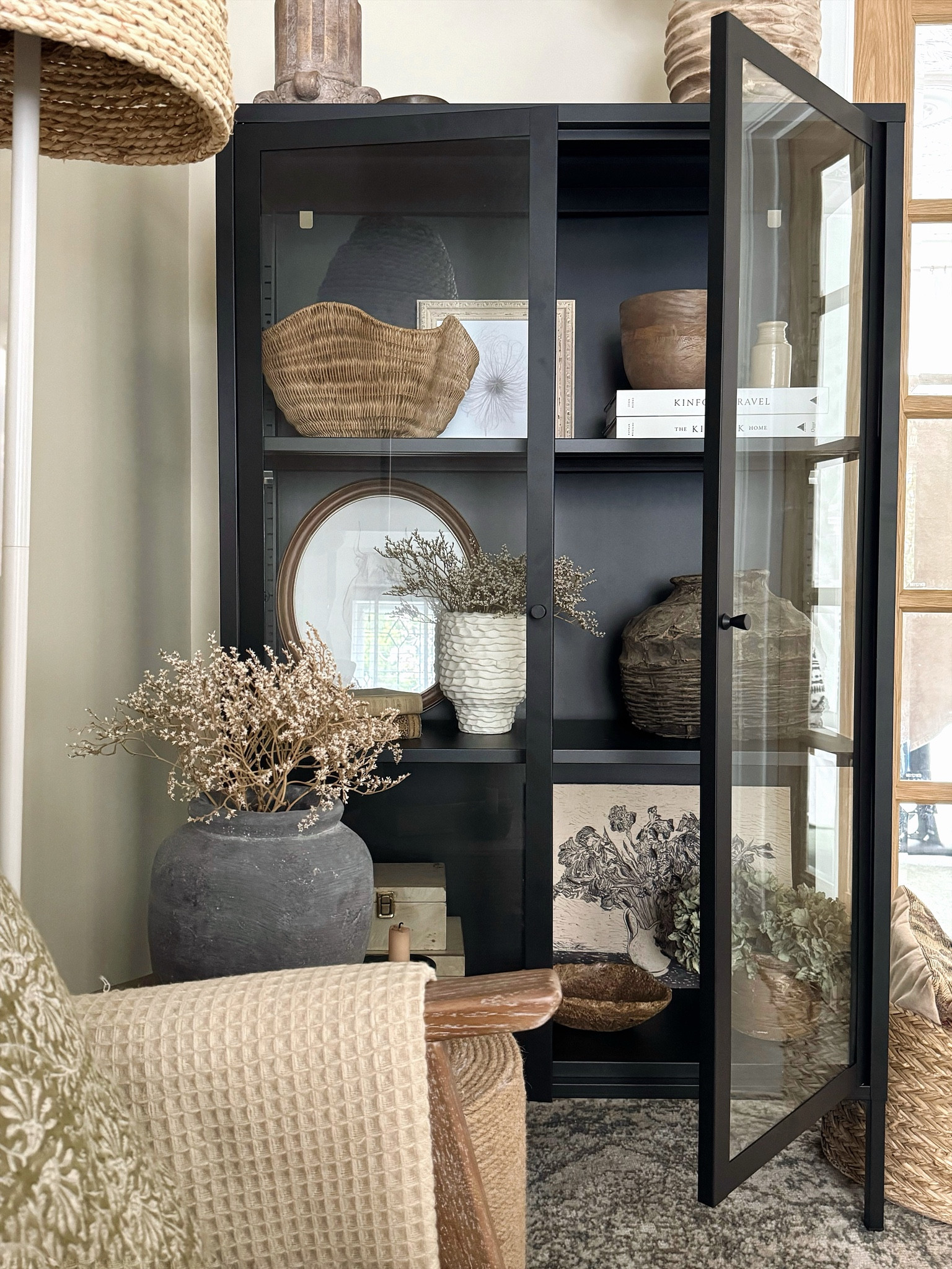 Shop this beautiful woven rattan basket styled here in my cabinet, for just £16!

#LTKhome #LTKeurope #LTKfindsunder50