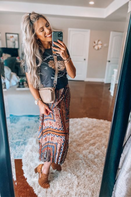 Such a cute Spring outfit that can be worn in the winter also with a jean jacket over. This maxi skirt was made for this graphic tee and $12! 
Crossbody is so cute and comes with 3 little bags in one!

#LTKunder50 #LTKstyletip #LTKFind