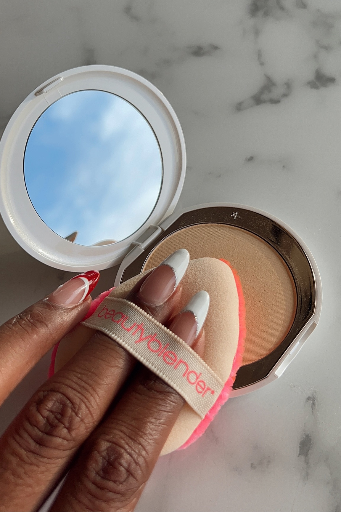My go-to under-eye brightening pressed powder by Charlotte Tilbury. 

Shade: Tan-Deep

I apply using the Beauty Blender Powder Puff, then follow up with Laura Mercier Honey loose powder 🫶🏾

#LTKbeauty