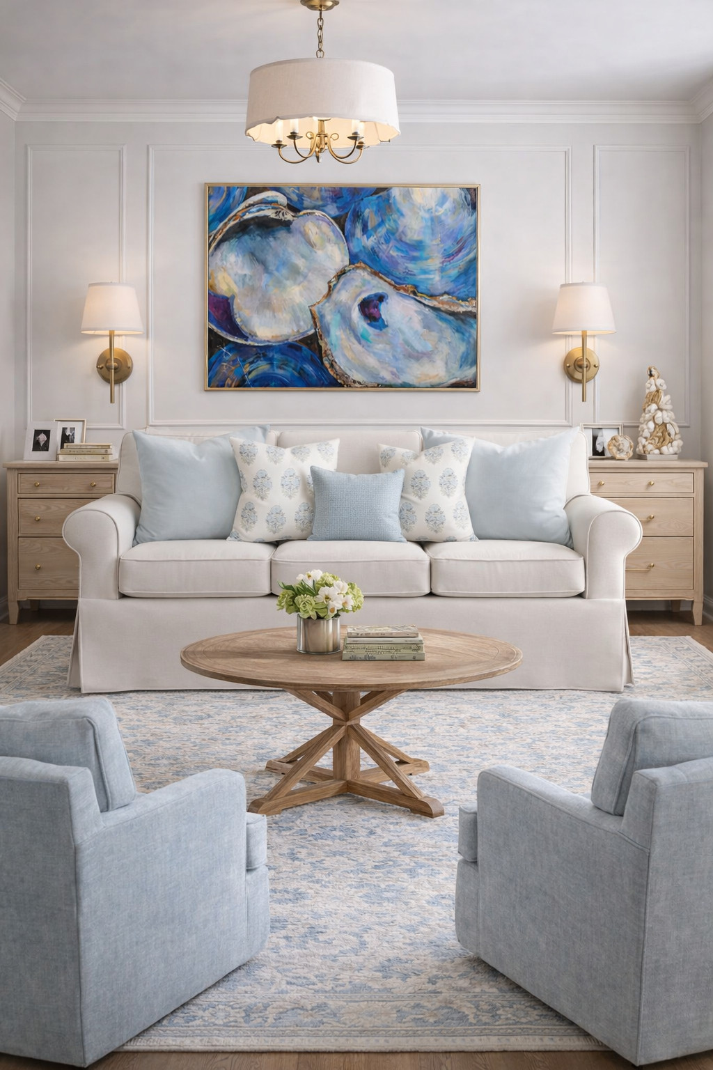 living room decor, neutral living room, coastal living room, coastal grandma aesthetic, blue and white decor, oyster artwork, traditional living room, southern style home, preppy home decor, gold accents, brass sconces, paneled walls, classic wall molding, light wood furniture, round wood coffee table, blue accent chairs, neutral sofa, throw pillow styling, coffee table styling, home inspo, cozy living room, elegant home, feminine home decor, chic living room, pottery barn style, target home finds, amazon home finds, LTK home, apartment living room, college apartment decor, sorority house decor, university of alabama style, bama apartment, southern home aesthetic, aesthetic living room, classic coastal, layered neutrals, warm minimalism, home styling ideas 

 

#LTKU #LTKHome #LTKSaleAlert
