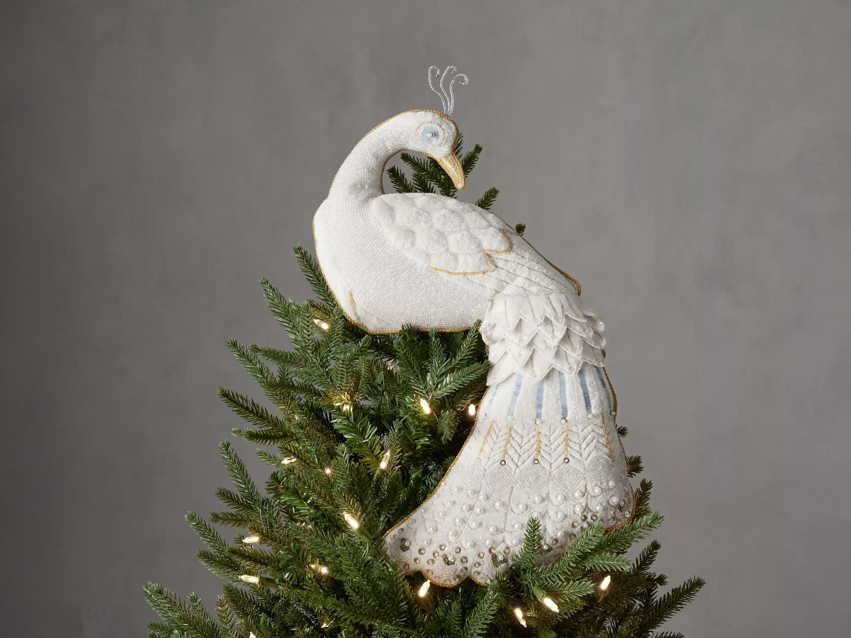 Peacock store tree topper