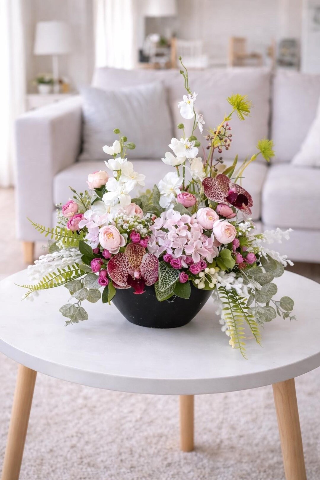 Bring a fresh spring feel to your home with this charming white and pink Easter centerpiece. Handcrafted with artificial plants in a decorative plastic pot, this arrangement adds soft seasonal color to any table, mantel, or entryway without the upkeep of fresh flowers. The delicate blooms and airy greenery create a cheerful focal point that’s perfect for Easter gatherings, spring decorating, or gifting to someone who loves timeless floral accents. A beautiful way to celebrate the season year after year. 🌸🐣

#LTKHome #LTKSpring #EasterDecor #SpringCenterpiece #EasterTable #SpringDecor #HomeDecorFinds #SeasonalDecor #EasterGiftIdeas #FloralDecor

#LTKHome #LTKSpringSale #LTKSeasonal