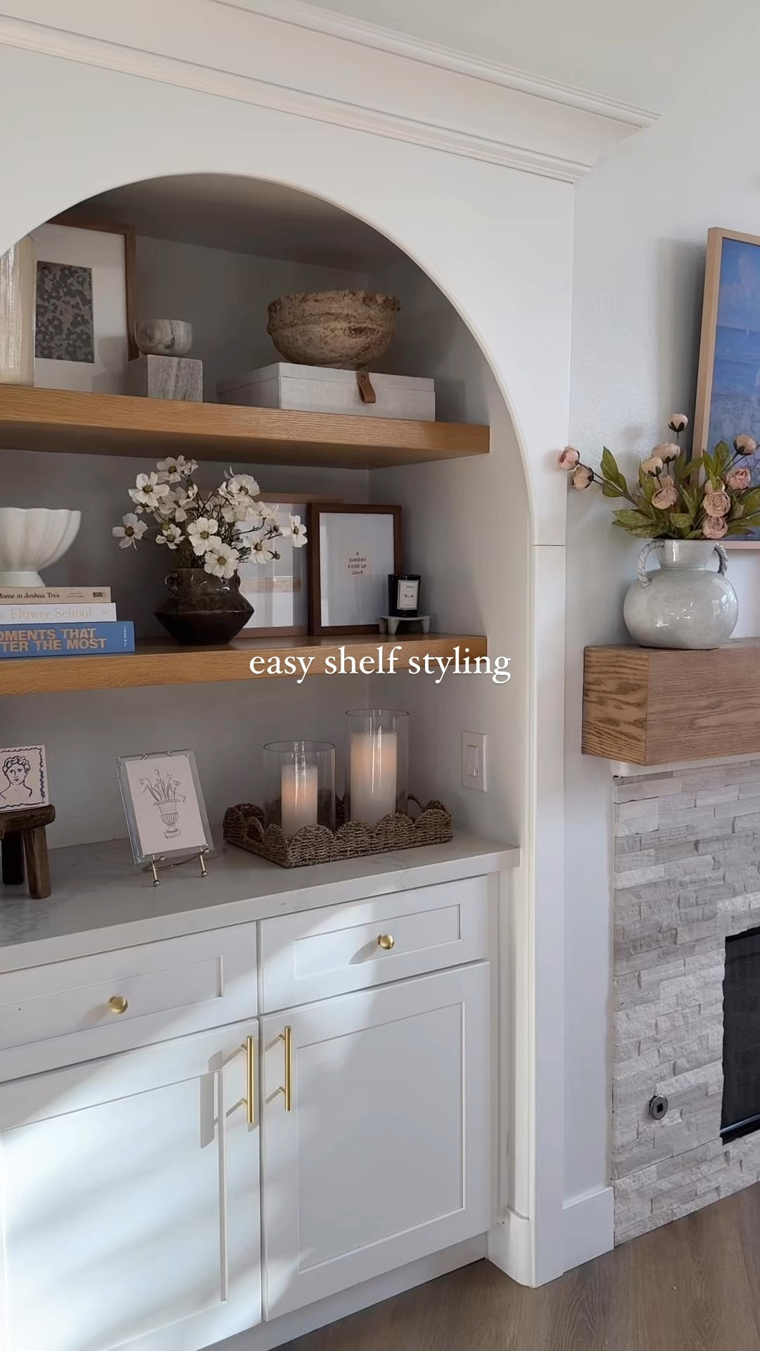 Shelf decor, shelf styling, living room decor, neutral home decor, arched cabinet, built in decor 

Flowers are cream cosmos from hobby lobby

#LTKHome #LTKStyleTip #LTKFindsUnder50
