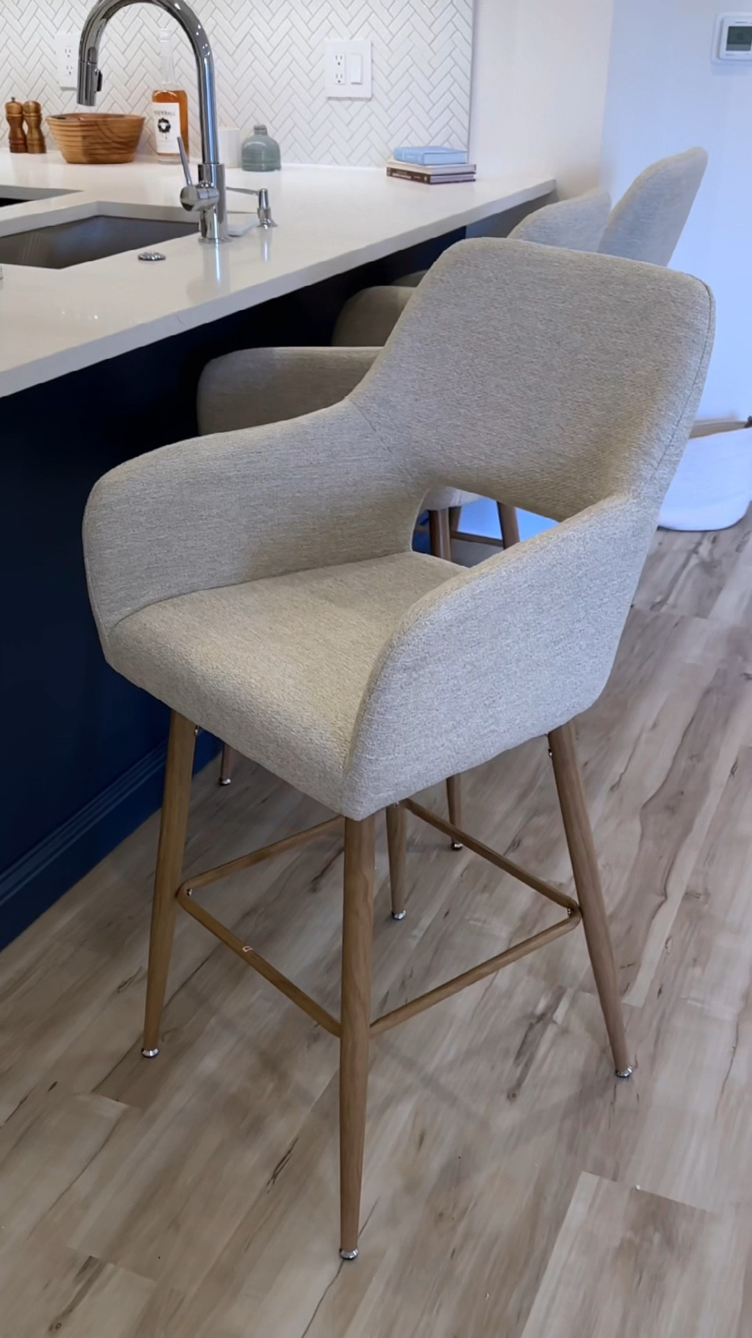 Beige countertop stool with wood legs and arm and back rests from Wayfair - home decor- furniture- kitchen counter stools

#LTKhome #LTKCyberWeek #LTKstyletip