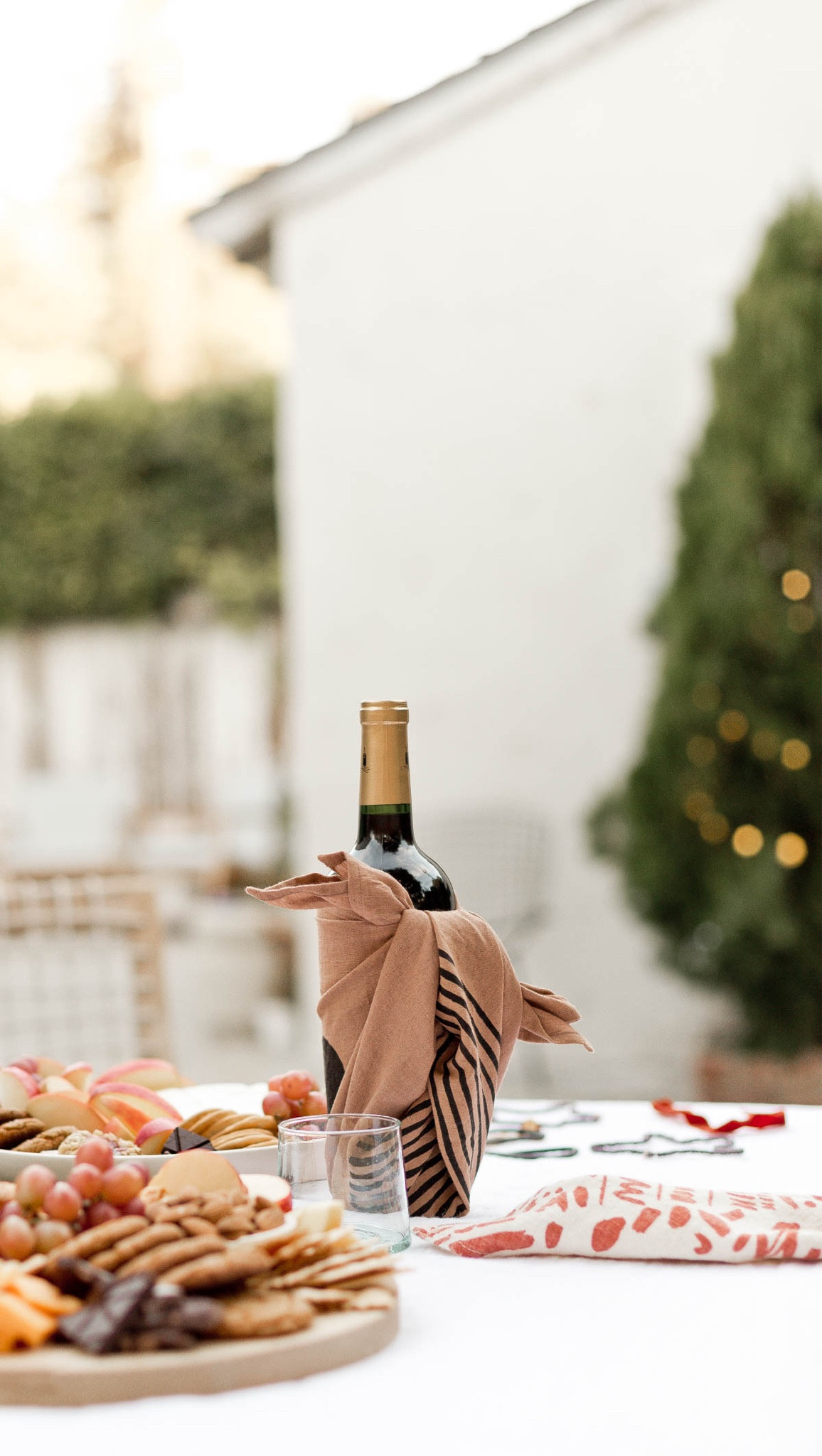 I like to use a big linen napkin or tea towel to wrap a bottle of wine as kind of a two for one hostess gift. Holiday entertaining - glassware - serving board - platter - charcuterie - linen napkins - fabric wine bottle wrap 

#LTKhome #LTKSeasonal #LTKHoliday