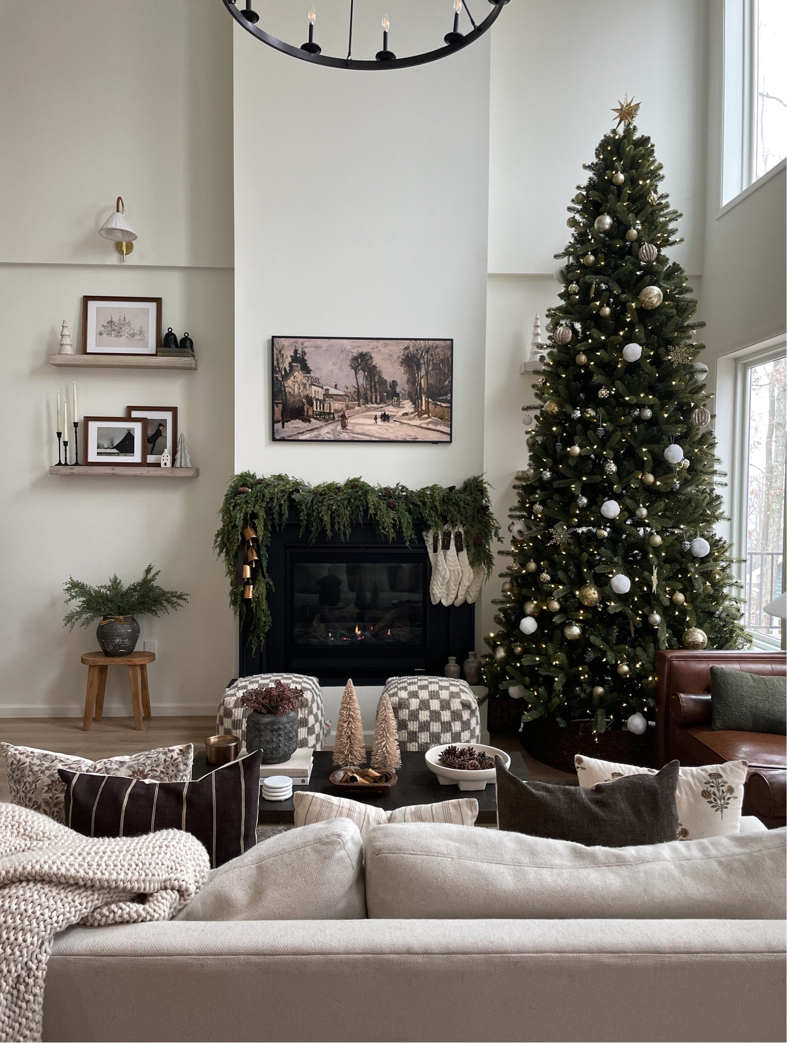 Kicking off December right w a cozy living room ✨ 

Living room, winter decor, Christmas tree, holiday decor, coffee table, white couch, leather couch, fireplace decor, stool, transitional space, checkered decor, pillows, frame tv, art, digital art, winter art, garland, ornaments, frames, shelf styling#LTKfindsunder50 #LTKhome

#LTKHoliday