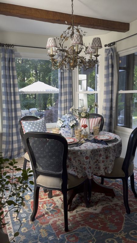 Breakfast nook decor ideas, buffalo check curtains, gingham drape panels, crystal chandelier, pleated chandelier shades, colorful rug, Ralph Lauren home, 4th of July table setting inspo, Americana decor, patriotic decor, tablescape, cane dining chairs, scalloped placemats

#LTKVideo #LTKSeasonal #LTKhome