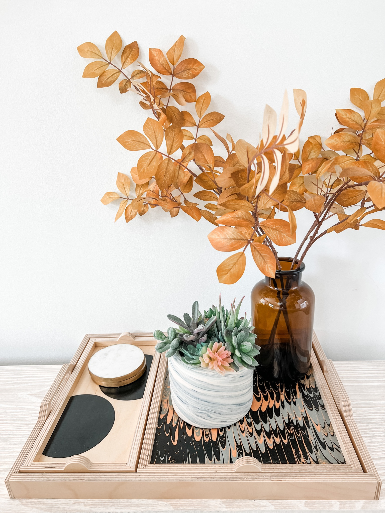 Add touches of golden faux leaves to your space to capture that fall feeling!🍁 Paired here on top of our birch wood nesting trays; they come in a few fun patterns and jazz up any table surface.

#LTKSeasonal #LTKhome #LTKstyletip