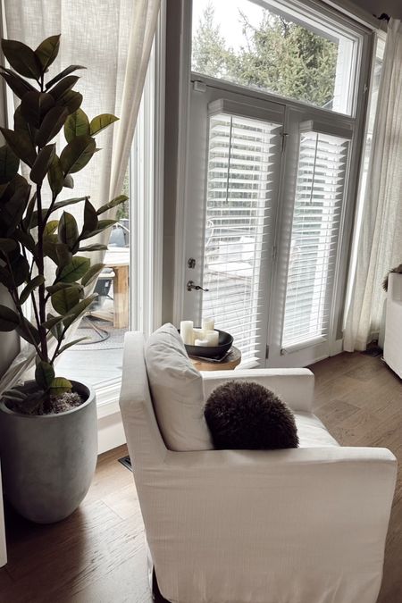 Living room home decor

White chair 
Olive tree 
Indoor plant 
Home decor 


#LTKhome #LTKstyletip #LTKSeasonal
