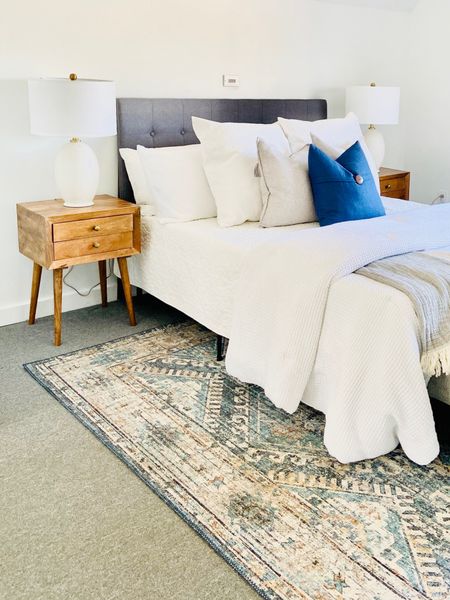 White lamps add great contrast to these wooden nightstands and dark gray headboard!
.
.
.
Mid Century Modern 
Wood Tones
White Lamp
Gray Headboard 
White Bedding 
Contrast in Design
Lamps Under $100

#LTKstyletip #LTKhome #LTKunder100