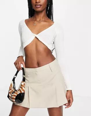 ASOS DESIGN 90s super micro mini skirt with pleats in twill in stone | ASOS (Global)