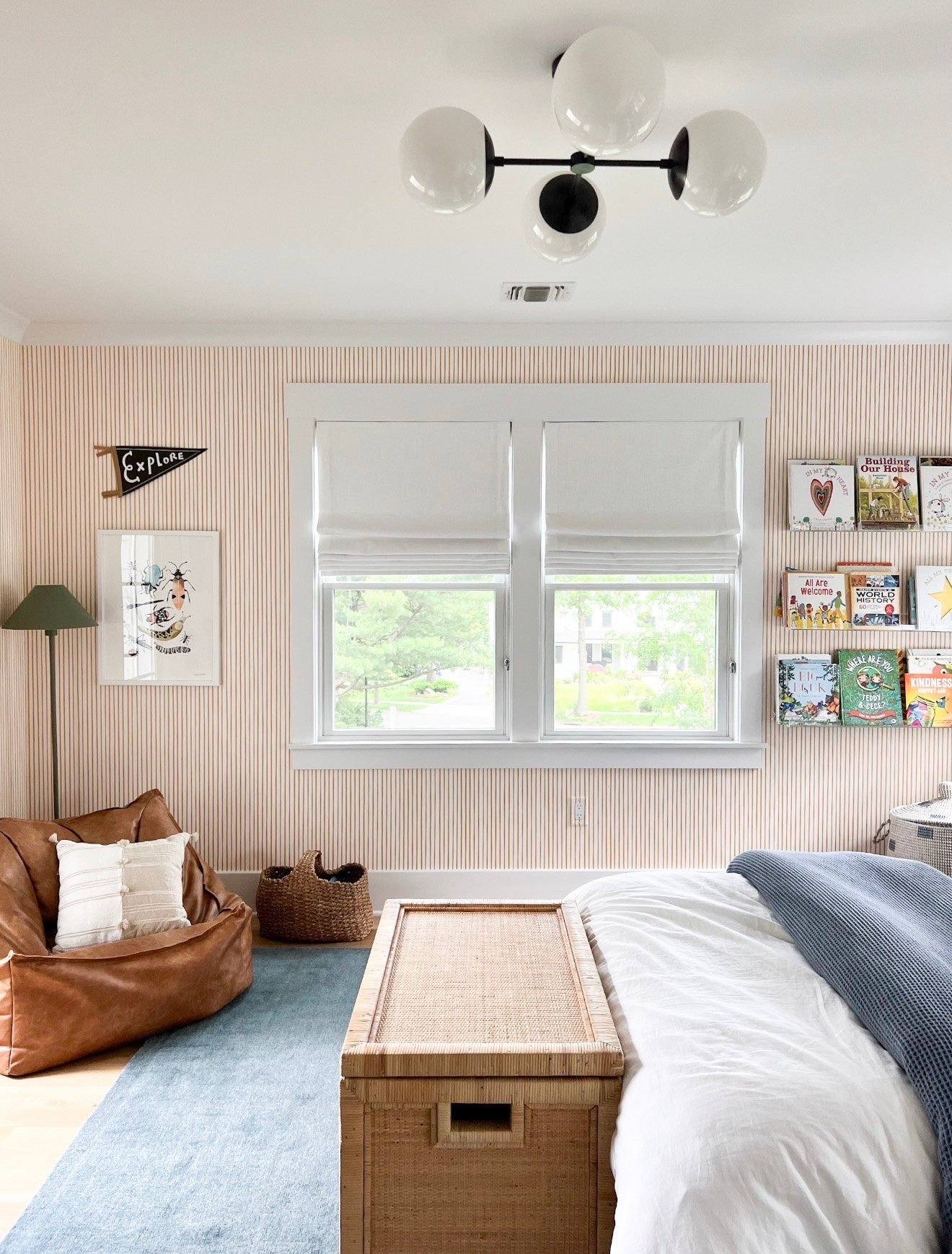 One of my favorite ways to make a kid’s room feel elevated is with statement lighting. This globe fixture adds so much personality to the space while still feeling timeless enough to grow with him over the years. It’s the perfect finishing touch for this cozy room.

kids bedroom, kids room decor, boys bedroom, statement lighting, globe light fixture, bedroom design, home decor, interior design, wallpaper ideas, room inspiration, girlonthehudson