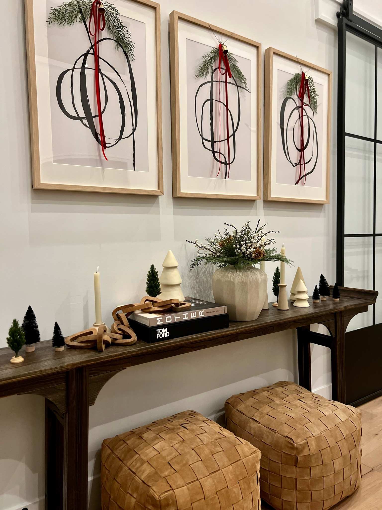 How’s, bells, and touch of greenery add a little holiday cheer to this space. 

Console table, console table styling, holiday decor, red bows, bells, faux greenery, home finds, art, collection prints 

#LTKSeasonal #LTKHome #LTKHoliday