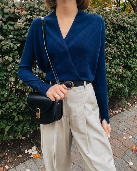 This navy cashmere wrap sweater is beyond soft and looks so good with black accessories like this sleek shoulder bag and belt.

#LTKworkwear #LTKover40 #LTKstyletip