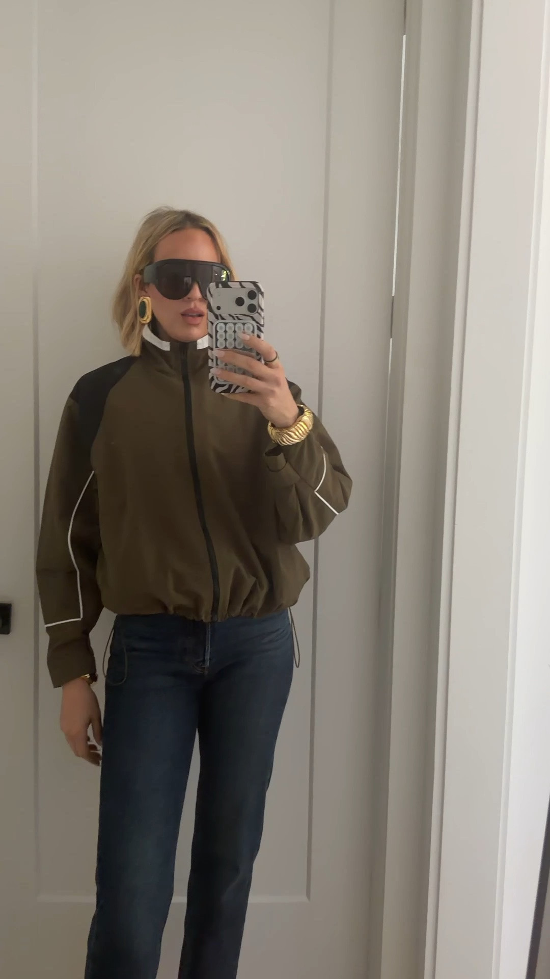 I’m wearing a medium in the track jacket. The jeans run tts but if you’re in between sizes, size up. The long inseam options are on the actual Levi site that I linked ￼￼

#LTKootd #LTKOver40 #LTKTall