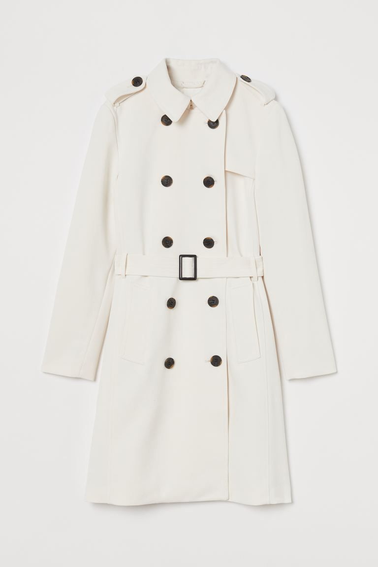 Double-breasted, knee-length trenchcoat in woven fabric with buttoned shoulder tabs. Belt with a ... | H&M (UK, MY, IN, SG, PH, TW, HK)