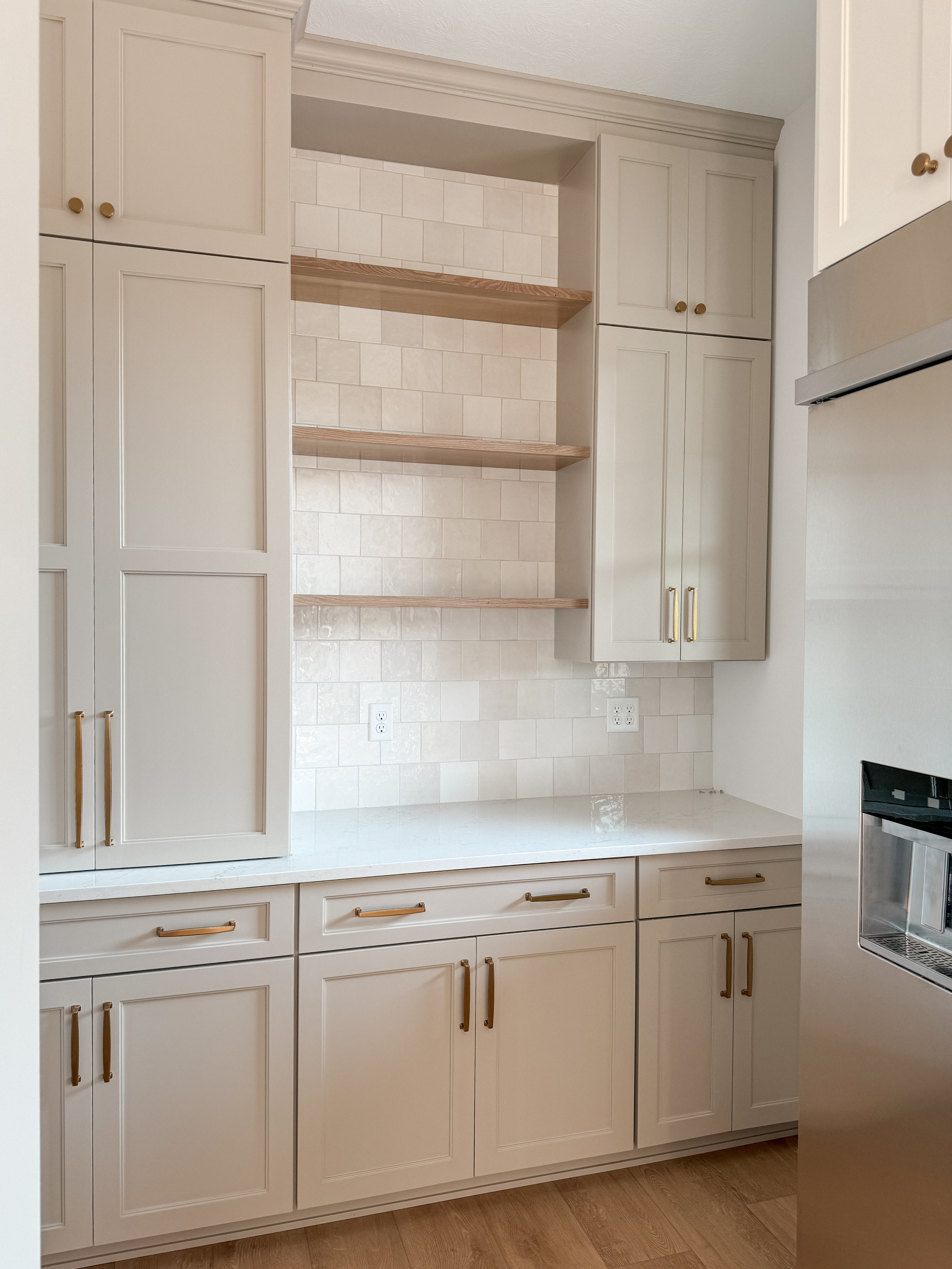Our kitchen butler’s pantry area is almost finished, and I couldn't be happier with how it turned out. The combination of clean lines and warm tones creates a welcoming space that's perfect for our new home. I’m especially loving the open shelving! Can't wait to start organizing and making this space truly ours!

#LTKHome