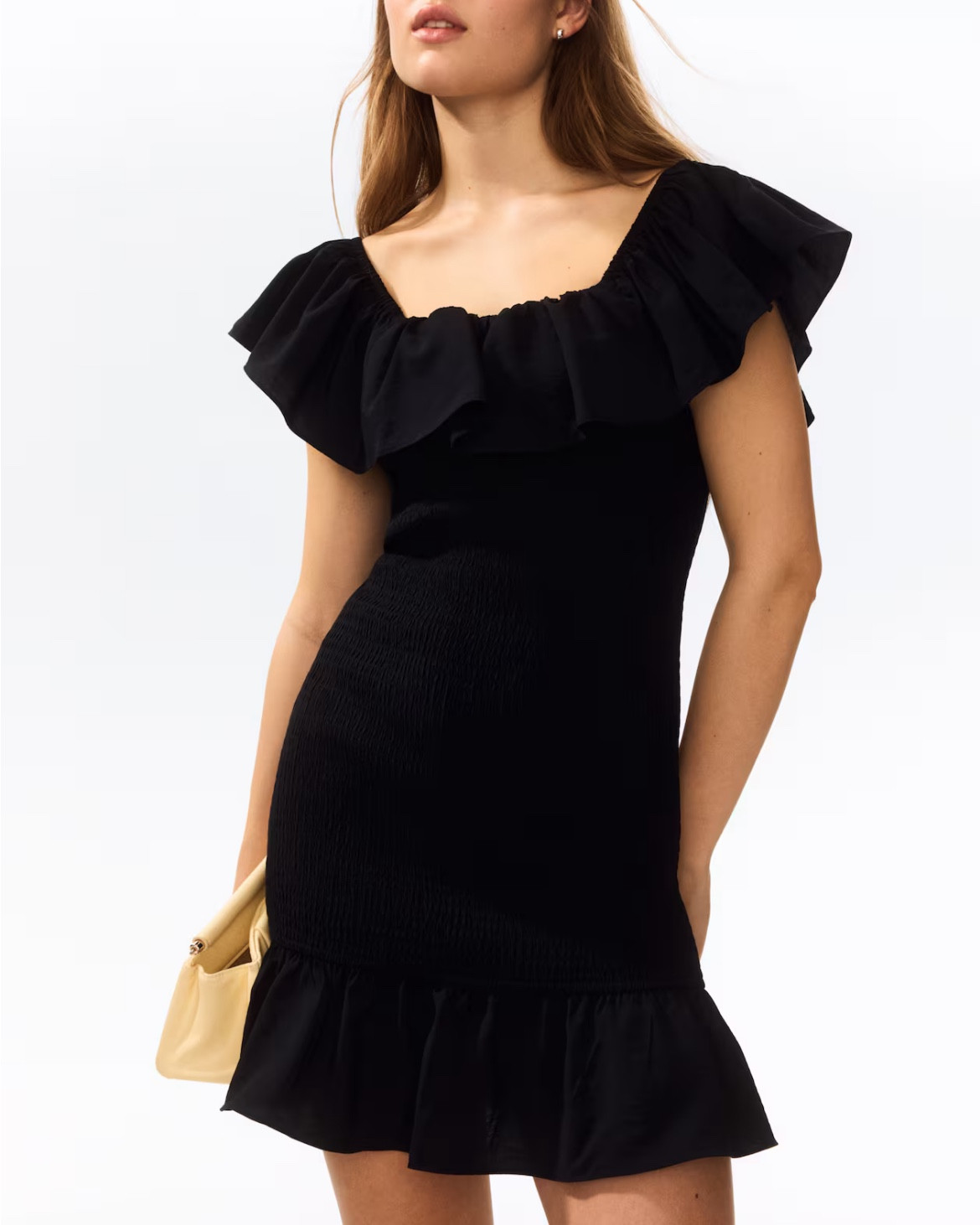 Black smocked ruffle mini dress 

#LTKSeasonal