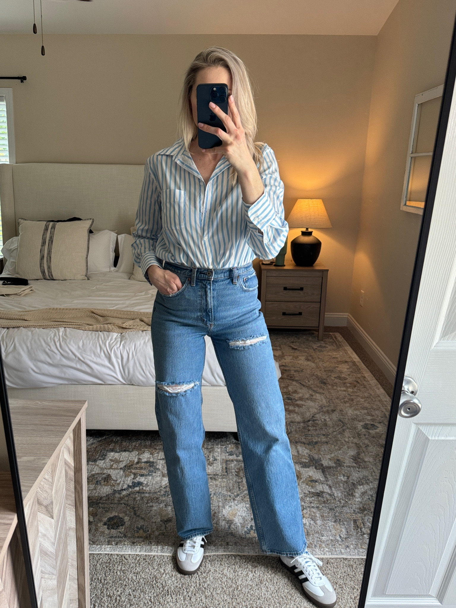 Casual outfit- blue and white striped button down, jeans and sneakers  

#LTKshoecrush #LTKfindsunder100
