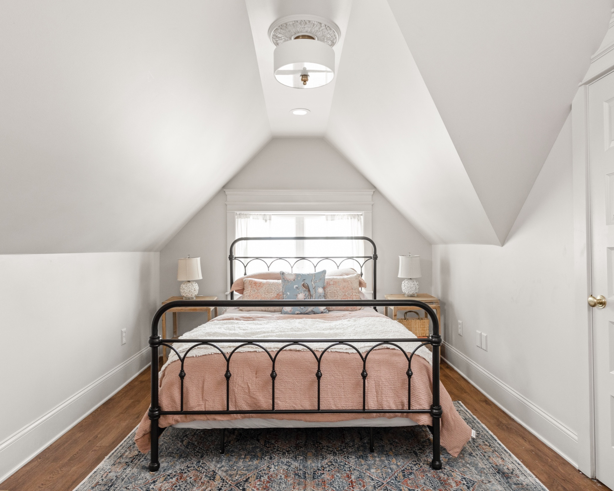 The pastel palette in the pink room helps the space feel larger even though the ceiling is a bit low.

#LTKhome