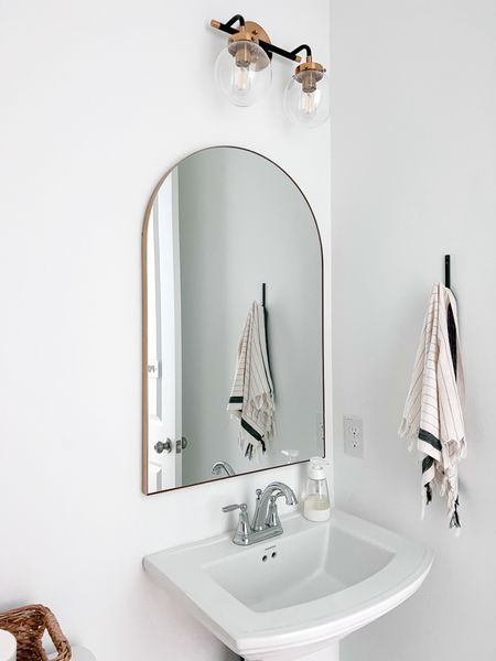 Love the new arch mirror. 

Brass arch mirror / gold arch mirror / vanity mirror / towel hook / vanity wall light / modern wall light / black and gold wall light / bathroom vanity light / affordable light / 

#LTKsalealert #LTKhome #LTKstyletip