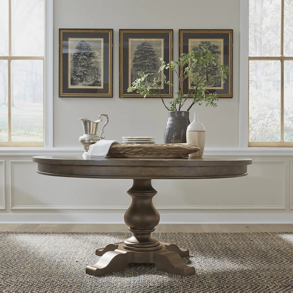 Warm + cozy. This pedestal dining table adds rustic farmhouse charm to any breakfast nook or eat-... | Wayfair North America