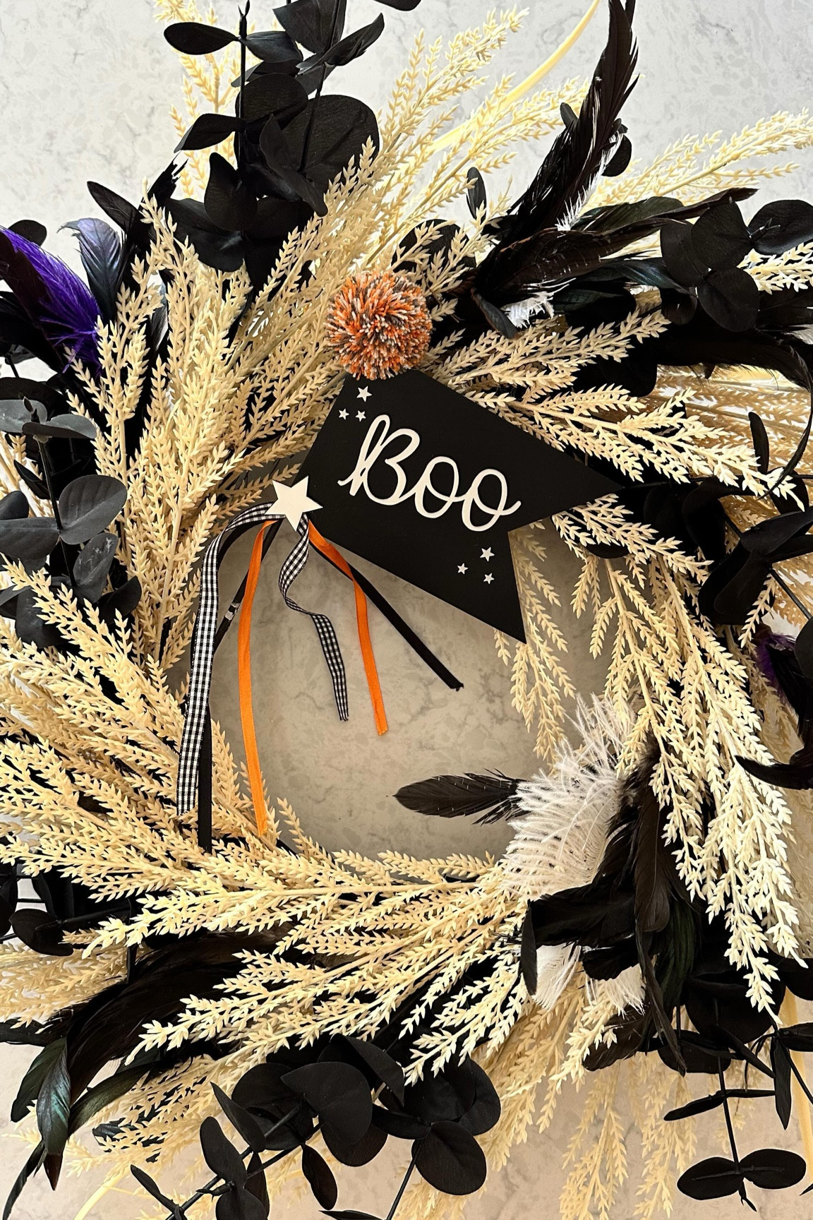 DIY-ish Halloween Front Porch Wreath 👻 

Take a basic wreath and make it BOLD with some pretty black faux plants, feather stems, and a darling little sign! Still bigger, fuller, prettier AND cheaper than the pricey ones in stores!! 💸

Comment “WREATH” for all the links sent straight to your DMs to make one of these pretty wreaths for your front porch! ✨

#halloweendecor #halloweenfrontporch #halloweenwreath