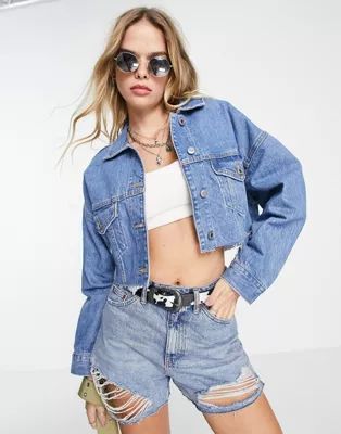 Bershka raw hem cropped denim jacket in light blue | ASOS (Global)