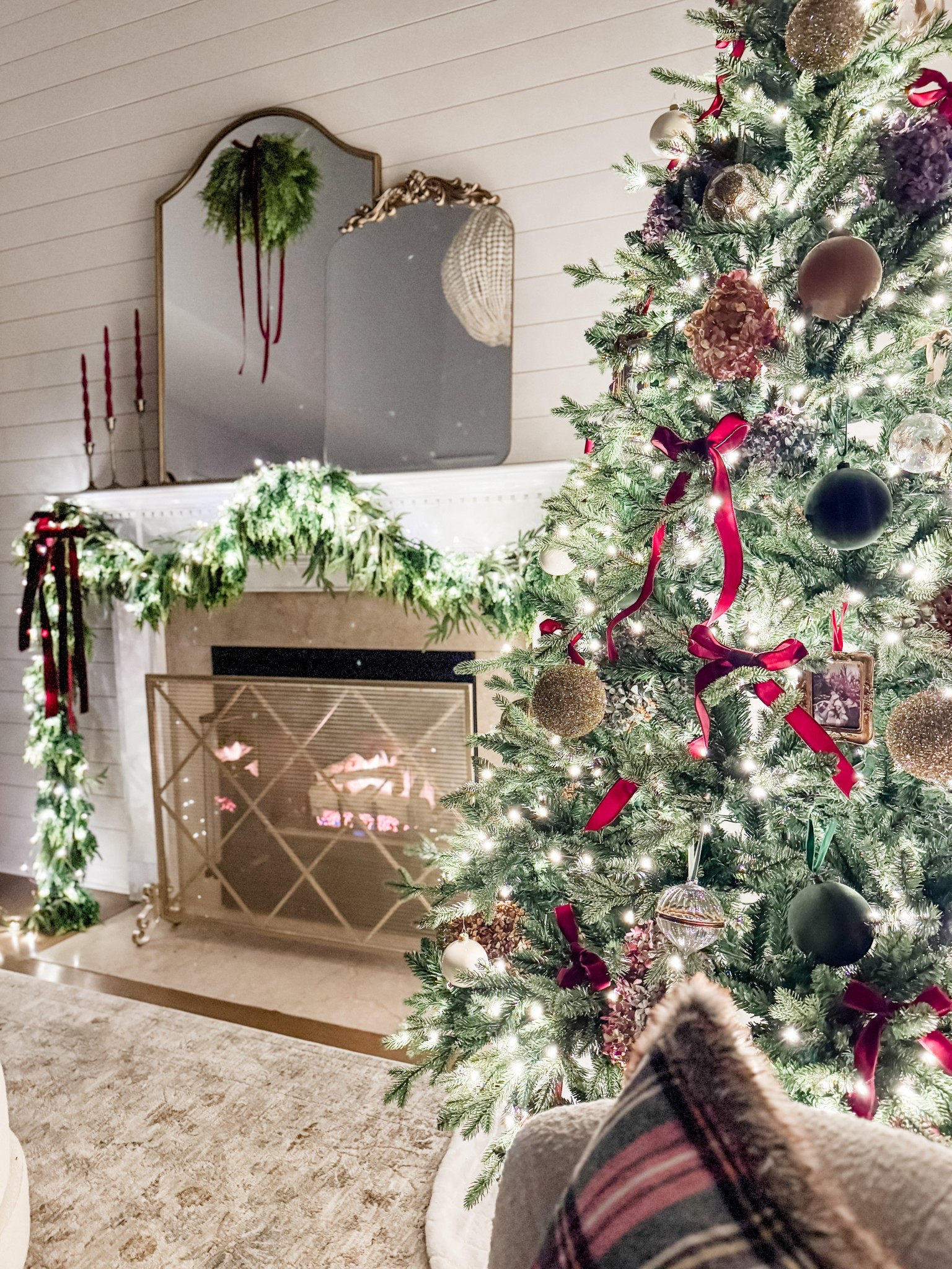 Christmas decor
Ralph Lauren Christmas aesthetic 
Burgundy velvet ribbon
Cedar garland
Norfolk pine garland 
Flocked ornaments
Velvet ornaments 
Mini cedar wreath
Mantel decor
Holiday decor
Fireplace screen
Mini hanging picture frame ornament 
Spiral taper candles 

#LTKHome #LTKSeasonal #LTKHoliday