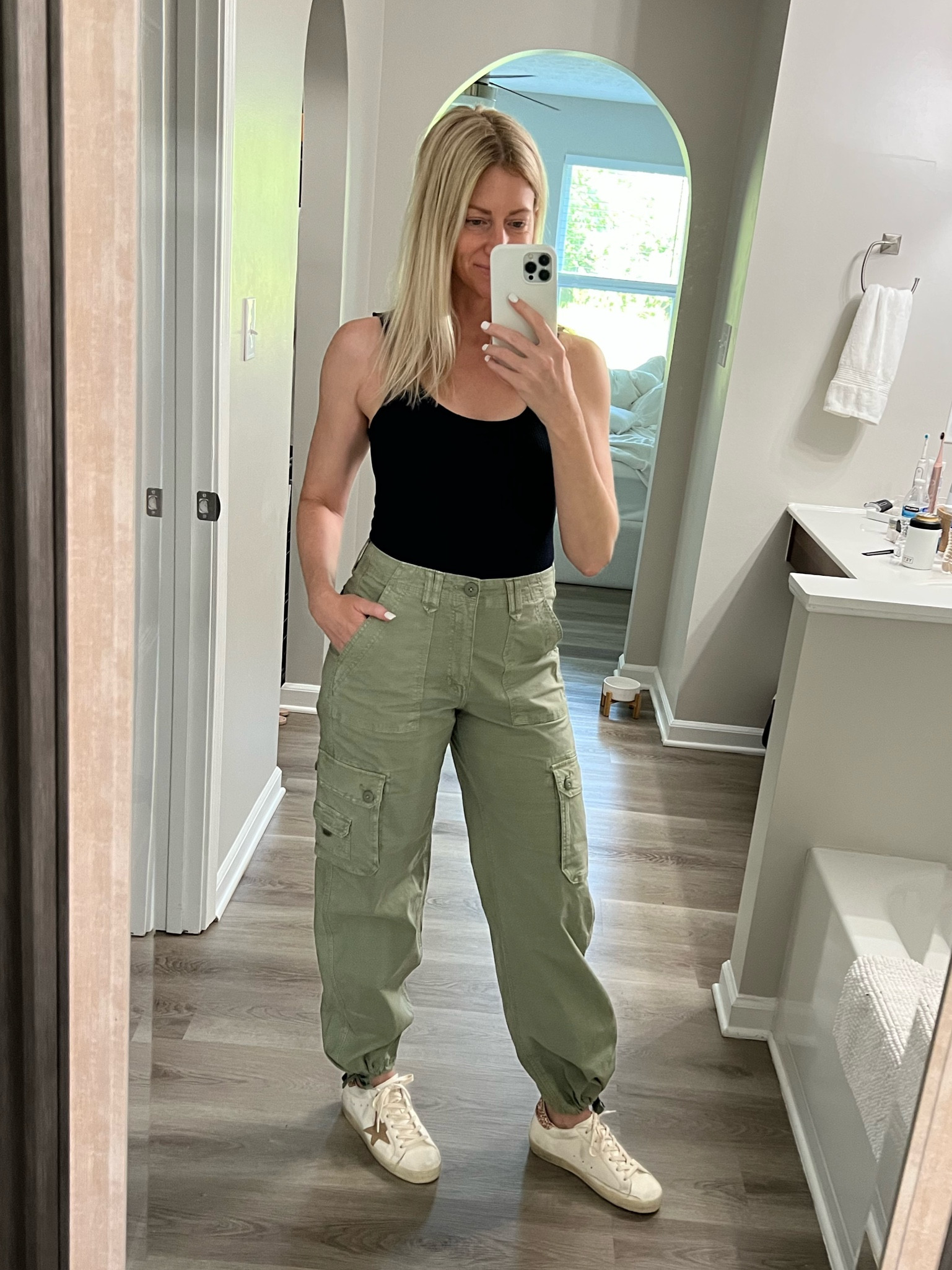 These cargo pants are on sale right now! They can be worn as joggers tied at the ankle or untied and straight, both styles are super cute!! Wearing size 4 and they fit perfectly. They have some stretch in the waist and the fabric so they’re really comfortable!🙌🏼#LTKfit 

#LTKstyletip #LTKsalealert #LTKunder50