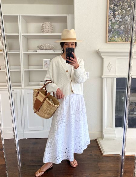 Spring outfit:
-Janessa Leone Sherman hat. I’m wearing a medium.
-Organic cotton cropped cardigan sweater. I’m wearing a small.
-Loewe medium basket bag.
-Eyelet midi skirt (linking a similar one).
- Leather flip flops that match the Loewe leather perfectly. 

Spring whites
Spring skirt
Travel hat 
Packable hat


#LTKover40 #LTKtravel #LTKitbag