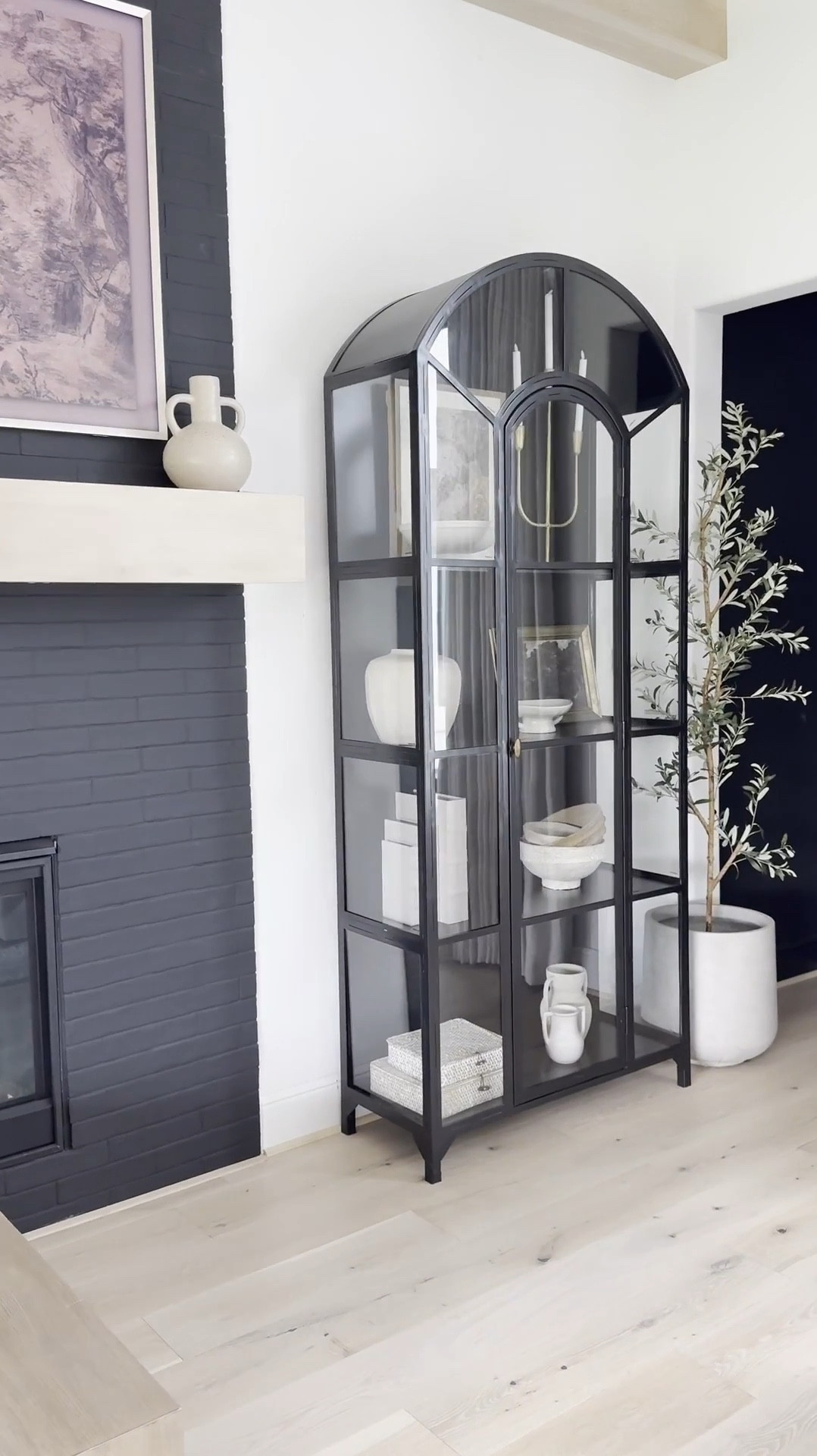 🤎
I've loved this classic cabinet for years plus it's truly a timeless piece that feels heirloom-worthy. ☺️ I love the
arched detail and glass panels that make it look like a work of art.

I now have three in my home! Two in the sitting room and one in the family room — and honestly, l'd add more if I had the space 😬😍

It's perfect for styling any room: dining area, next to a fireplace, bedroom, even an entryway. Solid and sturdy yet surprisingly easy to move. I love filling mine with neutral decor and adding a subtle pop of gold for warmth and contrast. A forever favorite 🖤

👉 I’ve linked the exact product plus similar options for easy purchase!#TimelessDesign #HeirloomQuality #HomeDecorFinds #ClassicStyle #InteriorInspo

#liketkit #LTKHome #LTKSaleAlert 