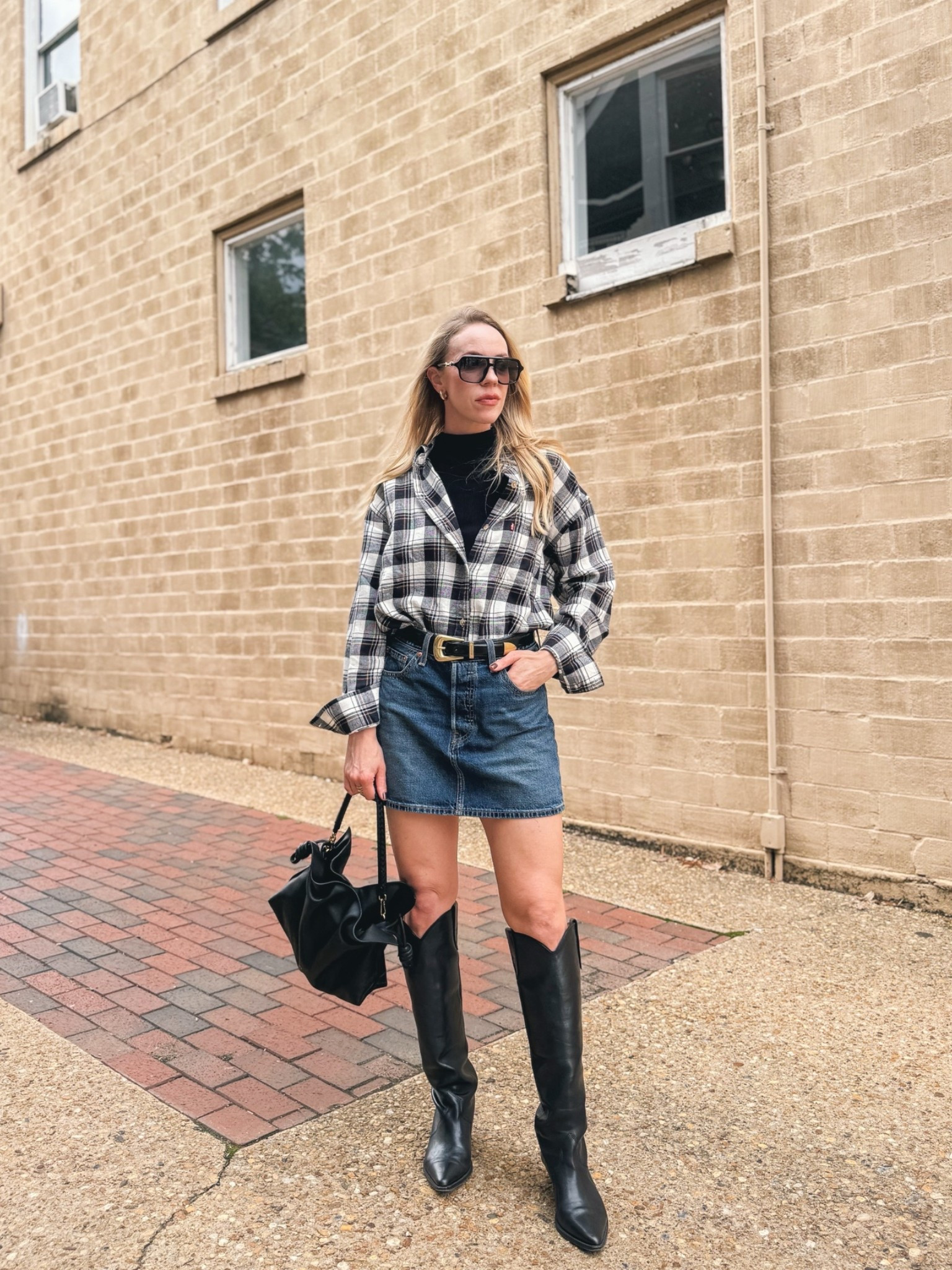 Flannel shirt with denim mini skirt and cowboy boots, western chic fall outfit, fall trends 2026