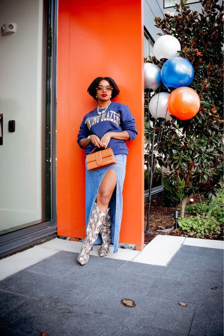 Target x Rowing Blazers Collaboration
Navy Sweater: Target x Rowing Blazers (XS)
Denim Skirt: Amazon
Snake Boots: Chinese Laundry 
Leopard Necklace: Nordstrom Rack
Earrings: Amazon 
Red Lip: The Lip Bar (Bawse Lady)
Nude Sunnies: Quay (High Key Micro)
Bag: Jacquemus (Bambino Grand)


#LTKshoecrush #LTKfindsunder50 #LTKstyletip