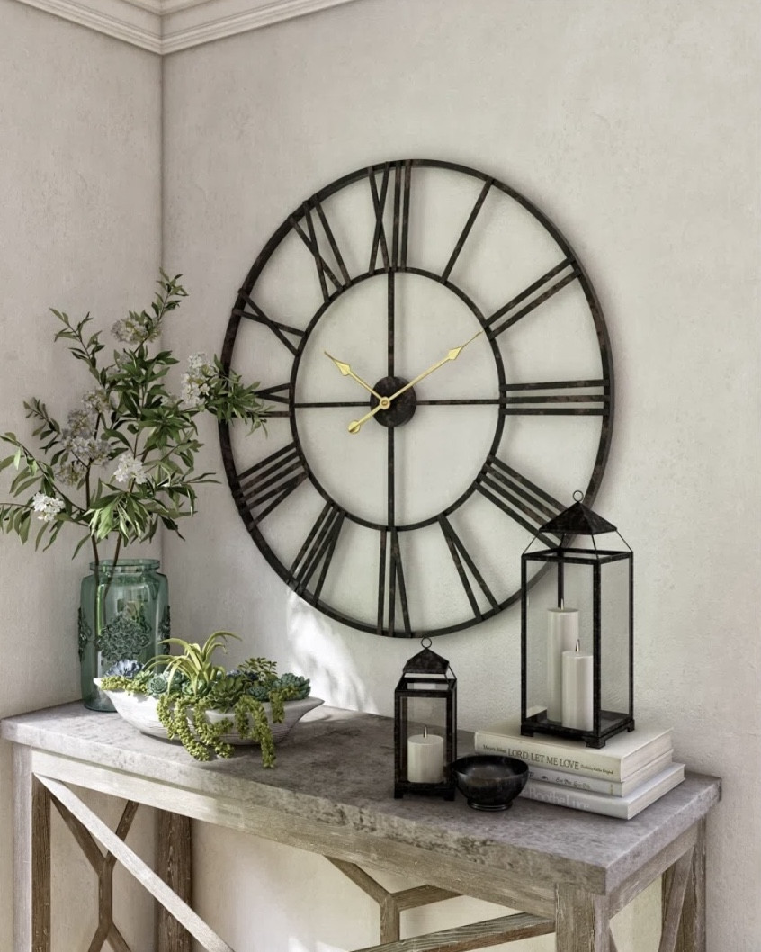Round Metal Wall Clock

This wall clock is the perfect piece above a console or in a bedroom  

#LTKFamily #LTKHome #LTKU