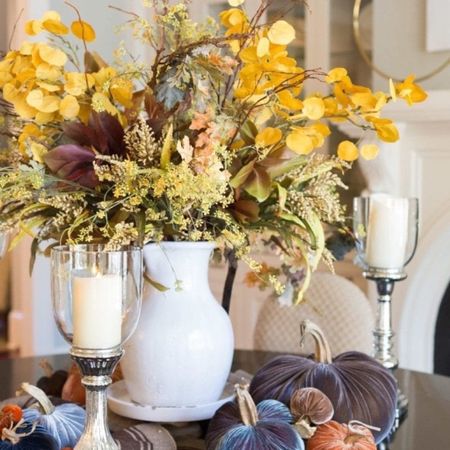 Fall flower centerpiece for Thanksgiving table. A Pottery Barn vase filled with faux fall flowers and surrounded by candles. 


#LTKHoliday #LTKhome #LTKSeasonal