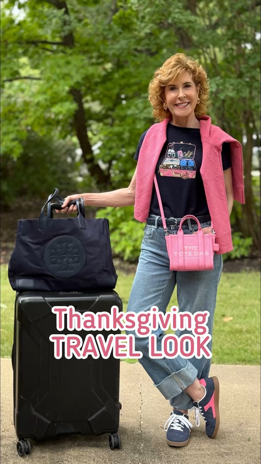 Heading out in my favorite travel Heading out in my favorite travel uniform—casual, comfy, and a little bit fun! A playful luggage tee, straight cuffed jeans, and a cozy cable-knit pullover over my shoulders keep things easy. But the real stars? My pink Marc Jacobs mini tote and these cute Walmart navy + pink sneakers!

#LTKOver40 #LTKSaleAlert #LTKTravel