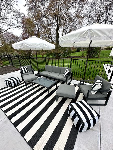 my @walmart patio backyard setup is almost complete! I am loving these cabana vibes with the neutral black & white classic look — this patio set is affordable & I am loving these fringe umbrellas under $100 from walmart home! Wow wow wow! better homes & gardens has stepped it up — this outdoor rug is the 9x12 version but there are plenty of other options & I love these outdoor bean bags too! Not to mention the striped outdoor pillows — 10/10! Can’t wait to show y’all more soon! #walmartpartner #walmarthome 

#LTKSeasonal #LTKhome #LTKfindsunder50