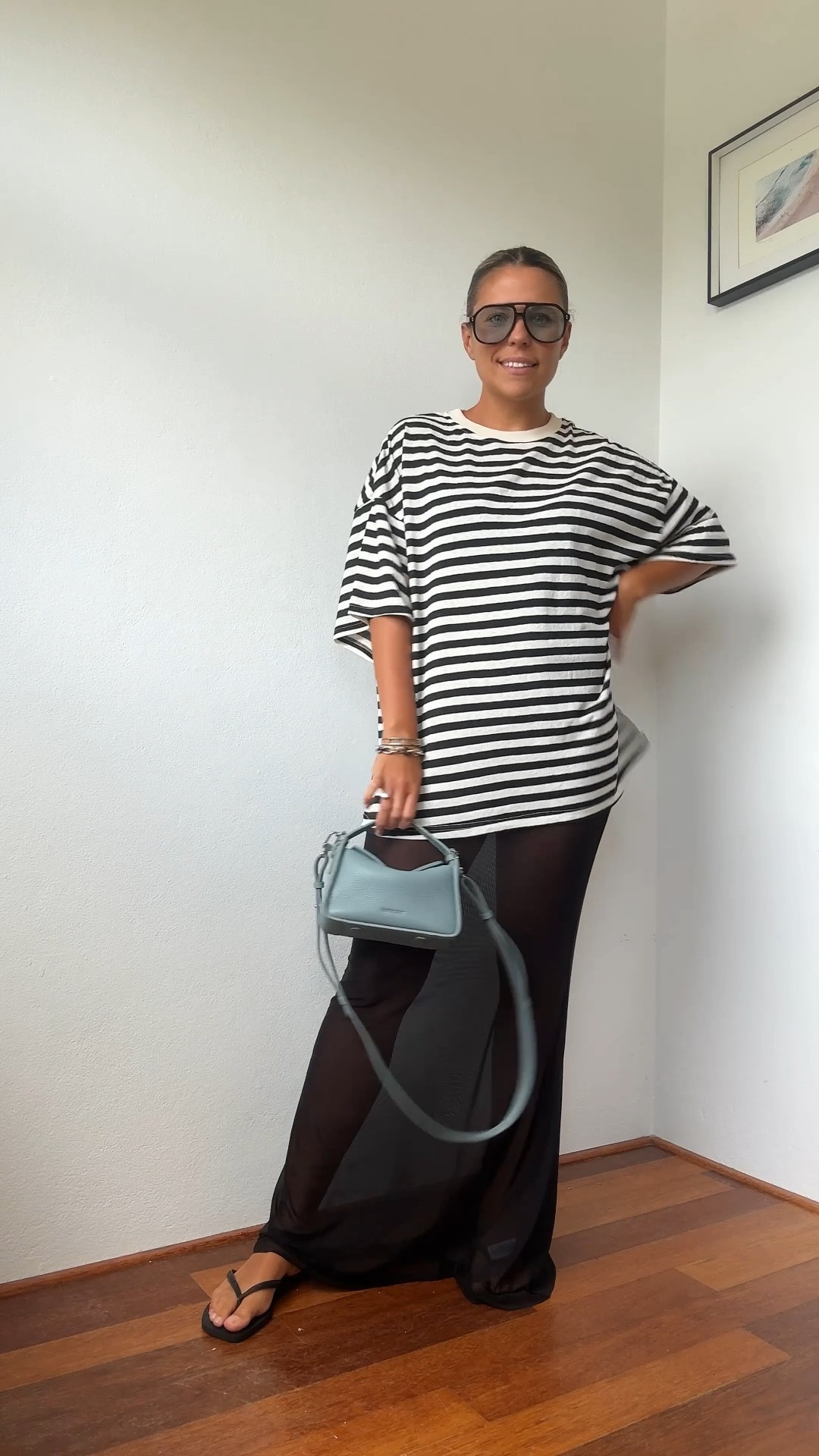 Love a sheer moment! Black and white outfit with a pop of blue.

Oversized sunglasses are BAULUS