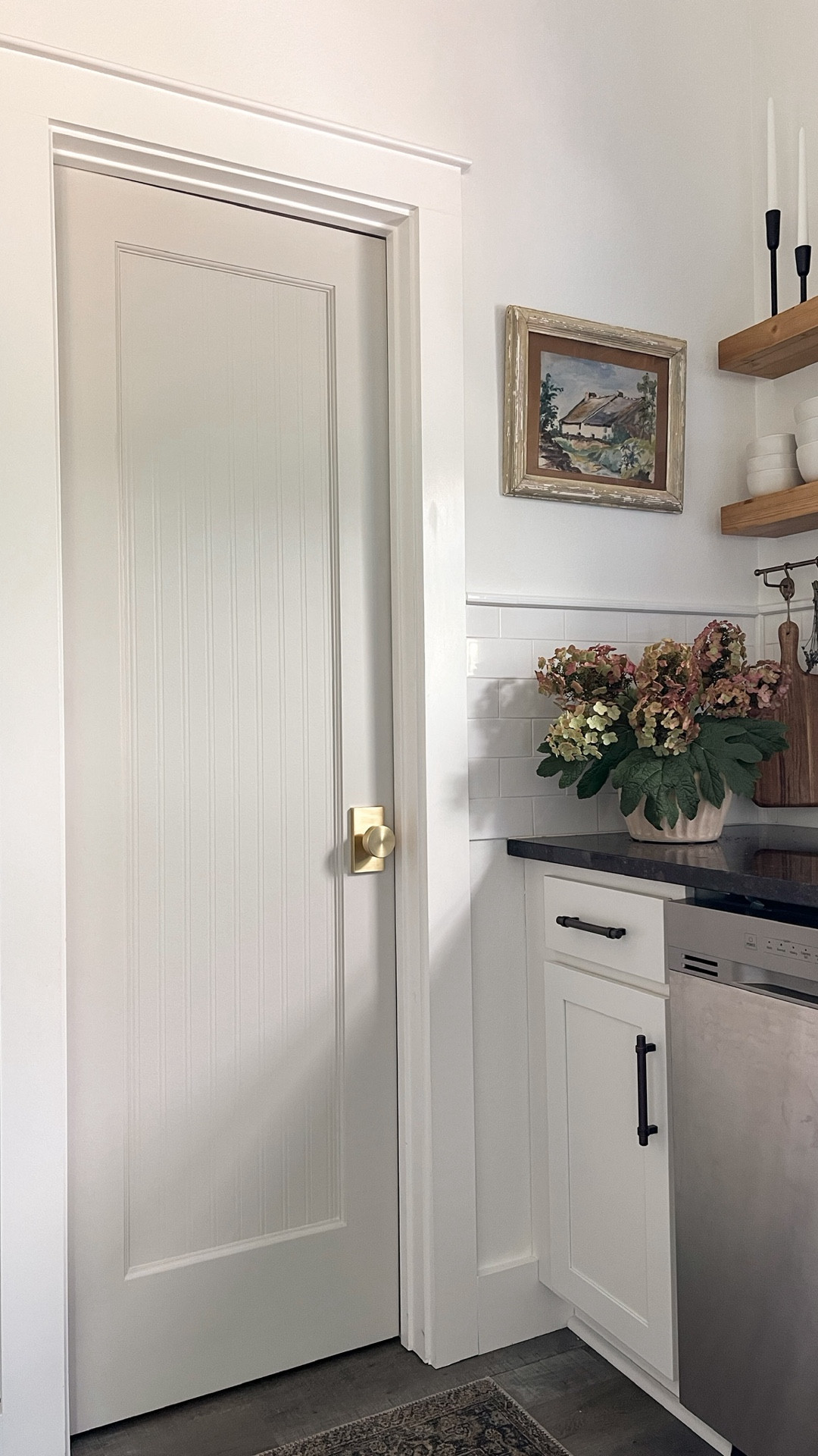 I turned my builder-grade pantry door into a beautiful custom piece for less than $50!

Here’s how:
1. Cut wallpaper to size
2. Apply glue spray adhesive to the glass and the back of the wallpaper, taking care to cover/protect surrounding surfaces. Note: You only need this glue if applying to glass, see notes below.
3. Hang paper while the door is vertical.
4. Caulk around the edges.
5. Paint and change hardware.

NEED-TO-KNOWS:
*Pre-pasted wallpaper doesn't stick to glass, so I found an adhesive that works for both paper and glass.
*It's workable for up to 10 minutes which made hanging super easy.
*Hang the paper while the door is still vertical BEFORE you take it down to caulk and paint. It's much harder to apply to a flat surface.
*Don't leave the door to dry in a non-temperature controlled environment like a garage. It will bubble up.
*This wallpaper is paintable and scrubbable!

#LTKHome #LTKFindsUnder50