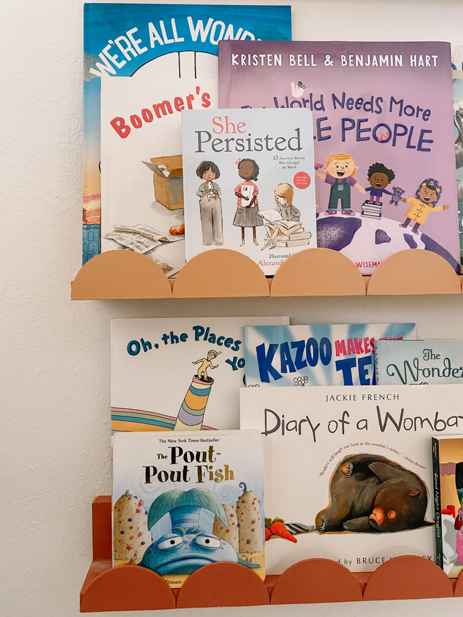 A few years ago we built these scalloped bookshelves and they've moved with us from house to house and from nursery to playroom! We made it by cutting these wood circles in half and attaching them to some scrap wood.

Plus, check out our list of some of our favorite books lining the shelf. 

 #LTKHome #LTKKids #LTKFamily