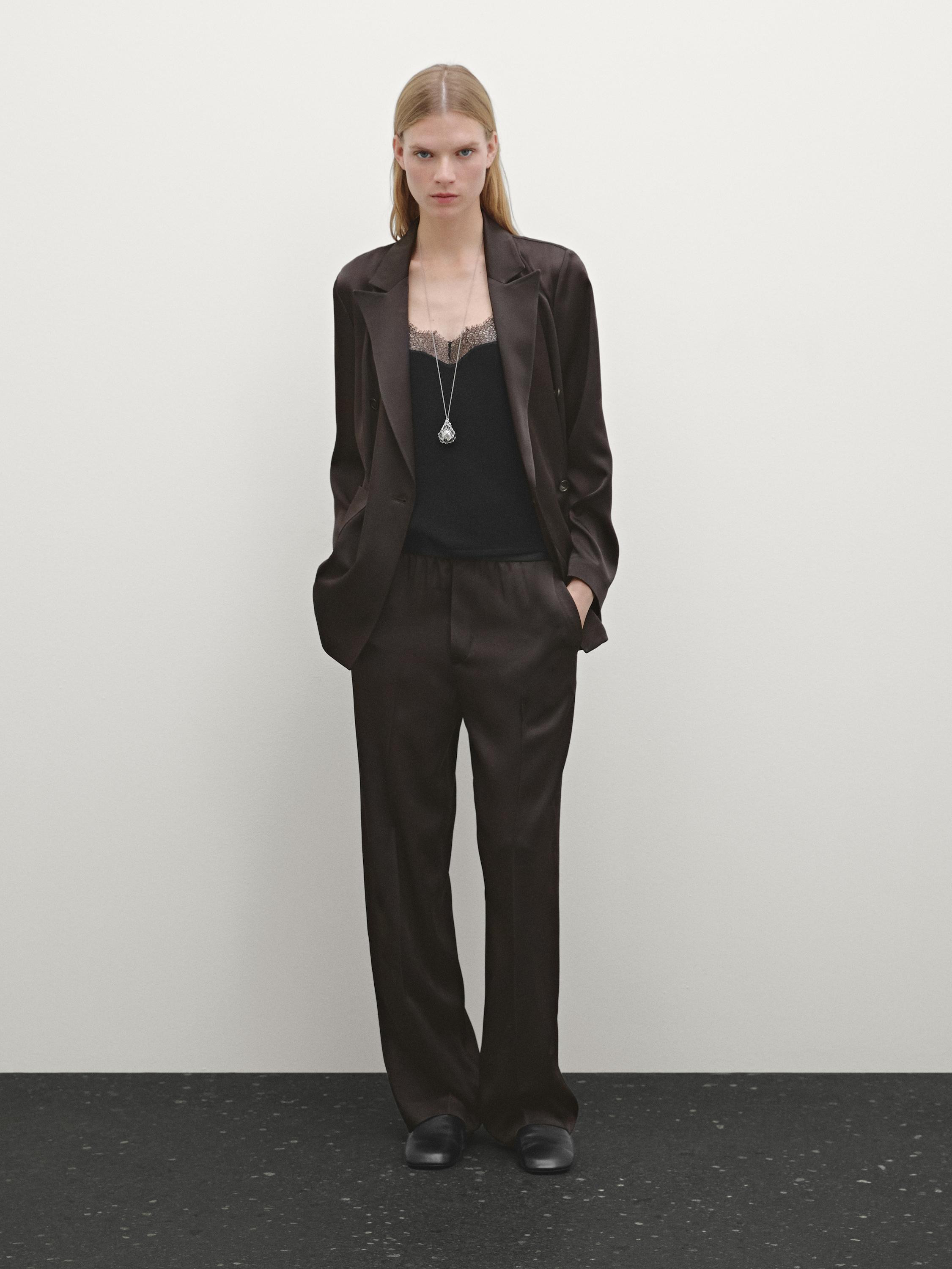 Wide trousers in satin finish fabric . Elasticated waistband detail. Two side pockets. Two welt p... | Massimo Dutti US