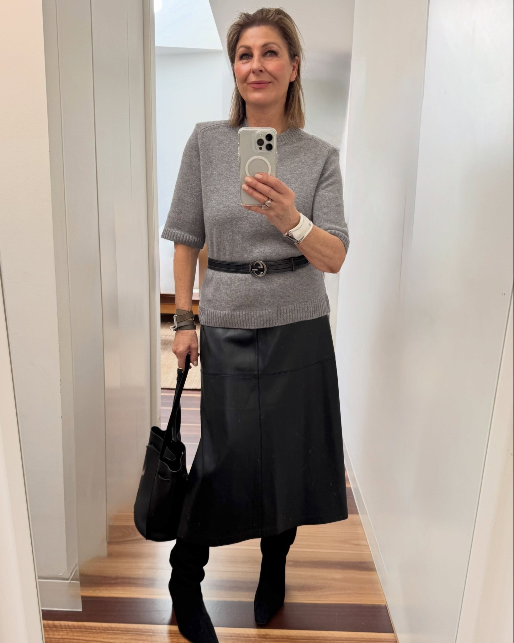 The wardrobe essentials to take you right through to spring …and into next winter? A chic short sleeve grey knit and a pair of fabulous knee high black boots. A short sleeve knit ( it’s a T shirt!) is so damn versatile.  It works under a coat, a blazer or a jacket. Best of all when it gets warmer ( or when you do; haha) it looks great on its own. 
* Love the FiFi approved round neckline 
* sleeves down to the elbow for coverage 
* Perfect length, hang out or easily tuck in 
* HINT: I actually put in some shoulders pads in the knit , they add structure, a little fashion edge too.

Let’s talk the black suede knee high boots: Saw these on sale @netaporter & knew they would slide right into my wardrobe✔️ Love the low kitten heel (walkable !) ✔️
The pointy blunt toe ✔️ Suede adds another texture ✔️
 Shop my picks at Netaporter here ‘

#LTKaustralia #LTKwinter #LTKover50style