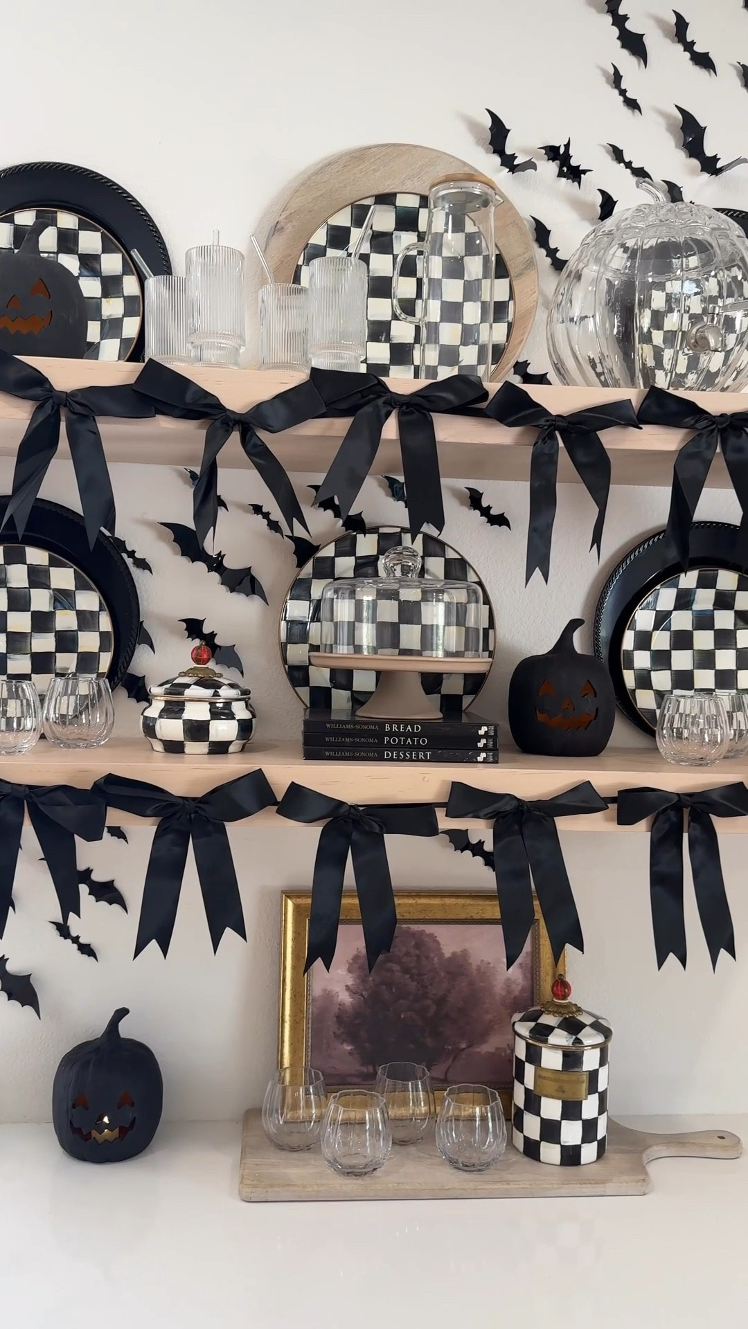 Halloween decorations 
Shelf styling 
Open shelving decor ideas 
Fall kitchen 
Black bats 
Black bows 
Black pumpkins 

#LTKStyleTip #LTKSeasonal #LTKHome
